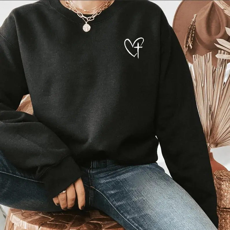 Jesus Has My Back crewneck sweatshirt, small heart cross on the chest and vertical script on the back