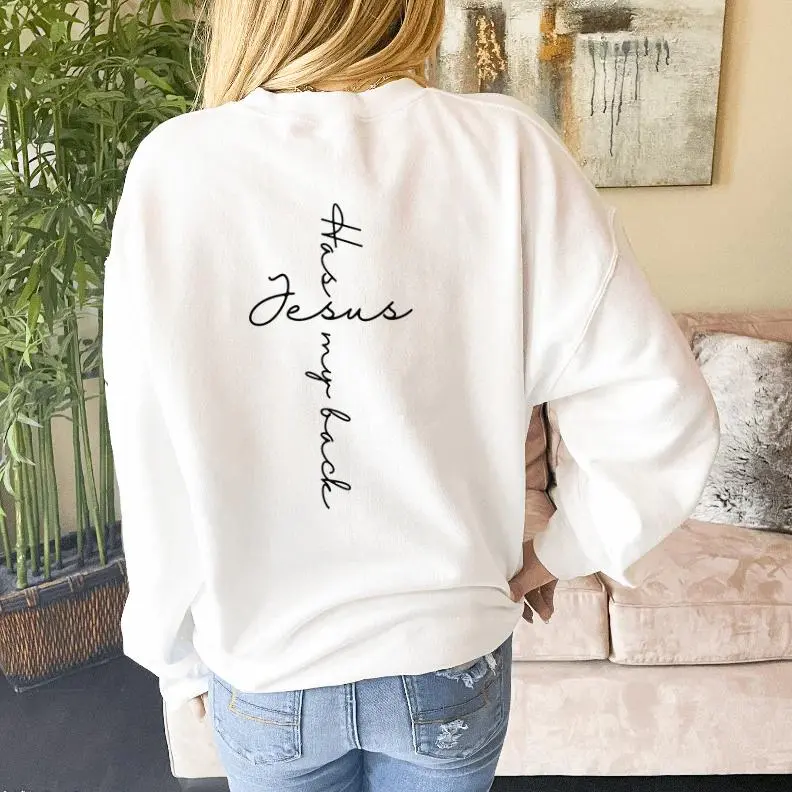 Jesus Has My Back crewneck sweatshirt, small heart cross on the chest and vertical script on the back
