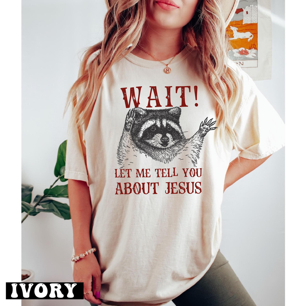 Wait Let Me Tell You About Jesus shirt, funny grunge raccoon with both paws raised, Christian raccoon tee
